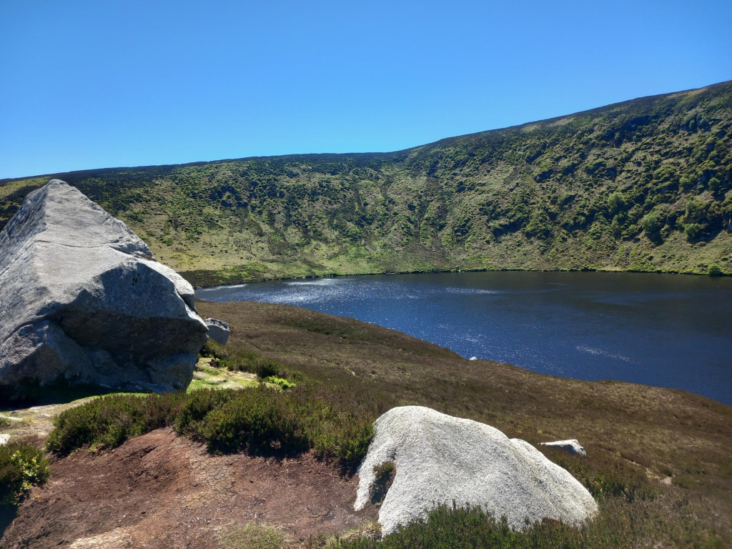 Upper Lough Bray lake and mountain slopes near the end of the loop walk